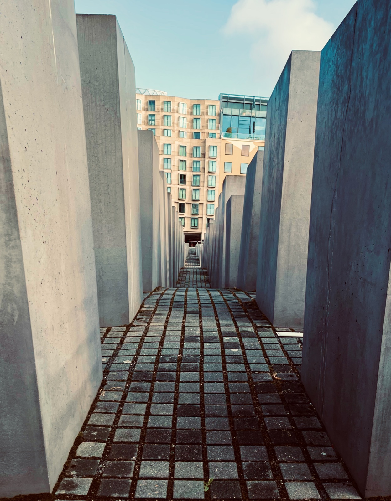 Corridor of grey concrete slabs at Berlin’s Memorial to the Murdered Jews of Europe