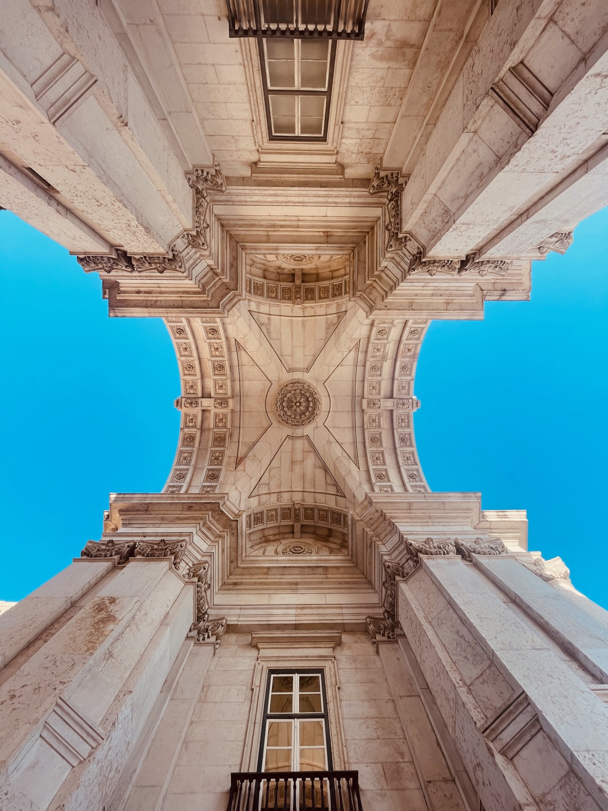 Looking straight up through the underside of Lisbon’s Rua Augusta Arch